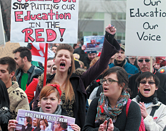 Students & academic staff from Mount Royal University rallied outside Alison Redford’s constituency office earlier this year to protest post-secondary cuts introduced in the province’s spring budget. [Ted Rhodes/Calgary Herald]