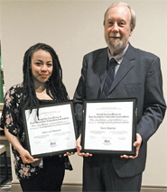 The winners for student category & professional category, Angelyn Francis &  Nick Martin, pose with their Excellence in Education Journalism Awards.