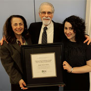 Holding the Distinguished Academic Award, Barry Grant poses for a photo with family members at CAUT’s annual meeting in Ottawa, on April 24, 2010.