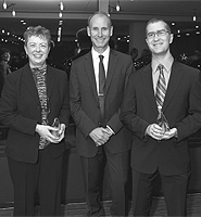 Achievements Rewarded — Carole Estabrooks and Paul Hayes celebrate their awards with Walter Dixon (centre), president of the Confederation of Alberta Faculty Associations, at a banquet in Edmonton Sept. 16.