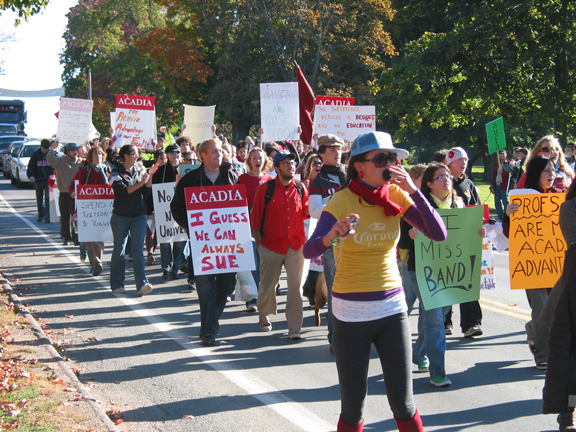 Day 3 of AUFA Strike — Hundreds of students, holding banners and shouting slogans, stage a solidarity rally with striking Acadia University Faculty Association members Oct. 17 in Wolfville, Nova Scotia. Professors, instructors and librarians went out on strike Oct. 15 after the university and union failed to reach a contract settlement. (Photo: John Eustace/Acadia University)
