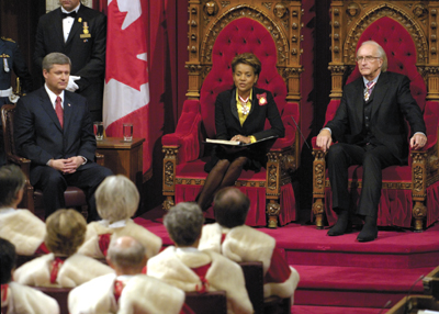 Governor General Michaëlle Jean delivers the throne speech Oct. 16, as Prime Minister Stephen Harper [left] and her husband, Jean-Daniel Lafond look on. (Photo: Sgt Eric Jolin/ Rideau Hall)