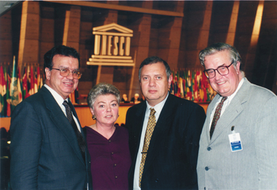 Former CAUT executive director Donald Savage (right) joins UNESCO officials Marco Antonio Dias (left) and Dimitri Beridze (third from left), and Pat Finn, executive director of the Carleton University Academic Staff Association, following UNESCO General Council’s adoption of the recommendation on thestatus of higher education teaching personnel in Paris Nov. 11, 1997. [Photo: Froger Viviane]
