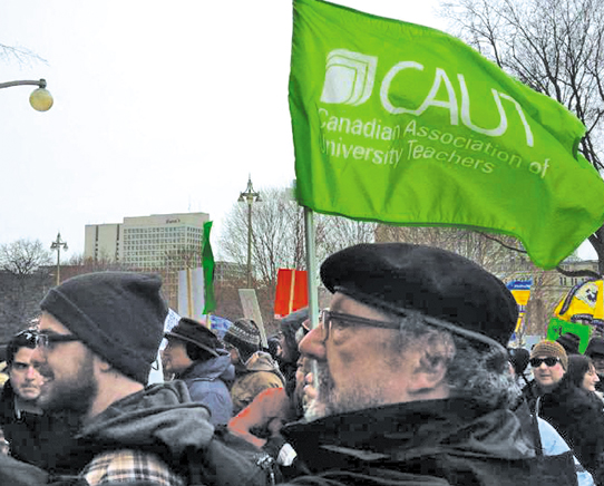 Demonstrators gather on Parliament Hill in Ottawa, March 14, during a national day of action protesting the Harper government's anti-terrorism bill.