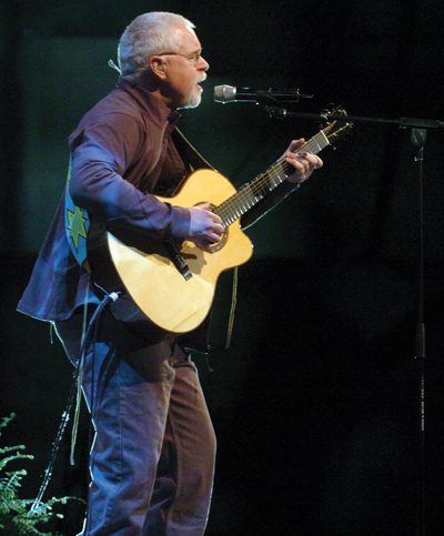 Canadian singer-songwriter Bruce Cockburn, seen here performing at the United Nations Climate Change Convention in Montreal on December 7, 2005, donated his time and talent for a FAUST-hosted gathering last month. [Photo: IISD/Earth Negotiations Bulletin]