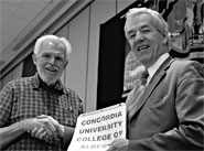 CAUT executive director James Turk welcomes William Freed, left, president of the Concordia University College of Alberta Faculty Association, at the council meeting in Ottawa Nov. 27.